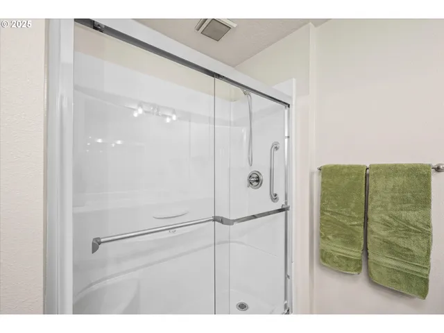 a bathroom with a sink mirror and vanity