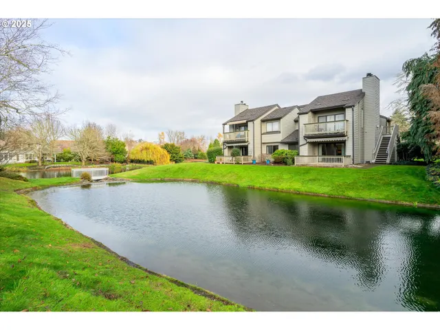 a view of a house with pool and chairs