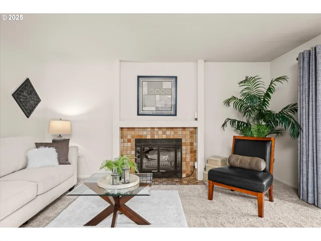 a living room with furniture gym equipment and a fireplace