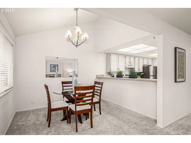 a kitchen with a stove a refrigerator and a sink