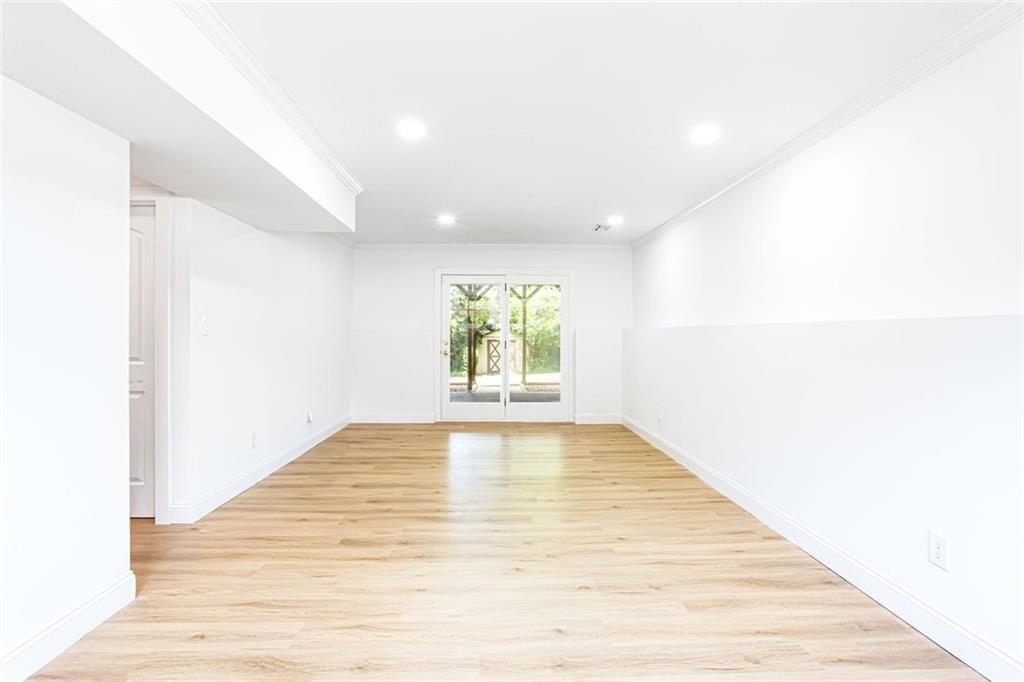 2814 Goodfellows Road Tucker, GA 30084 - Photo 33 of 46 a view of an empty room with wooden floor and a window