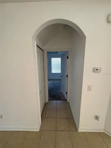 a view of a hallway to a bedroom