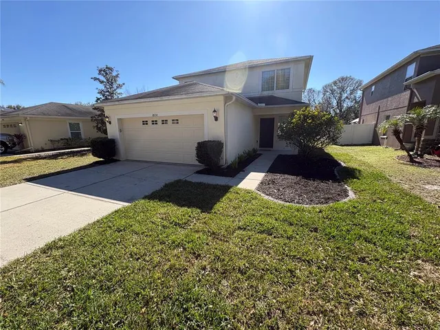 a house view with a backyard space