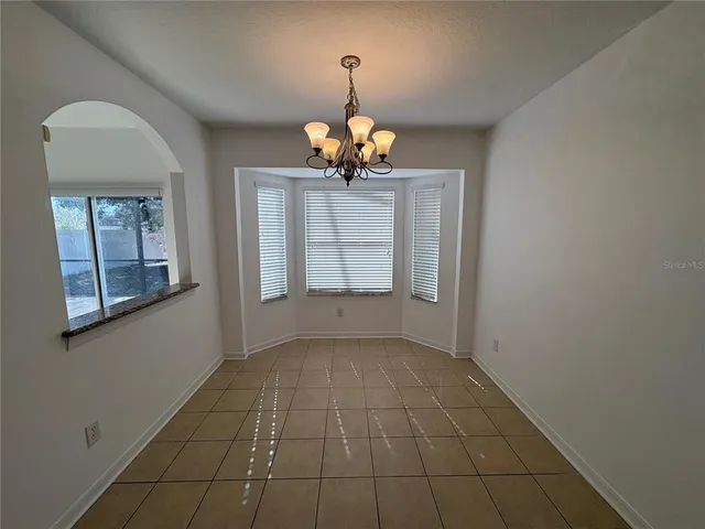 a view of a room with wooden floors and natural light