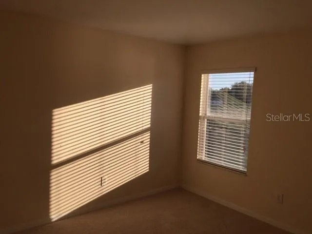 a view of a room that has a window in it