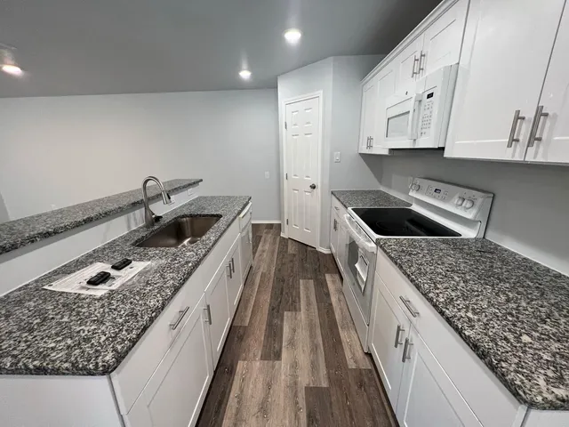 a view of a hallway view with staircase