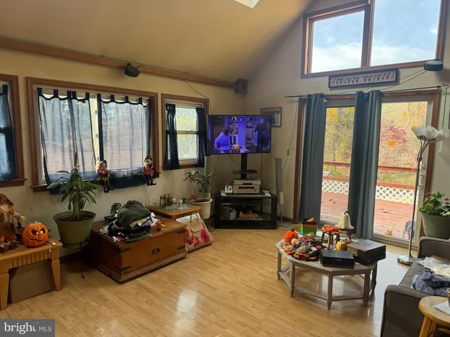 a living room with furniture and large windows