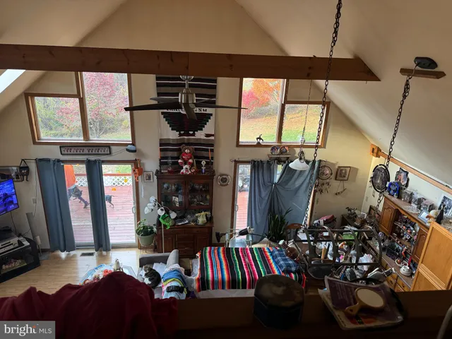 a living room with lots of furniture and a flat screen tv