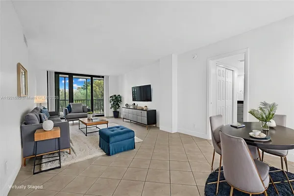 a living room with fireplace furniture and a flat screen tv