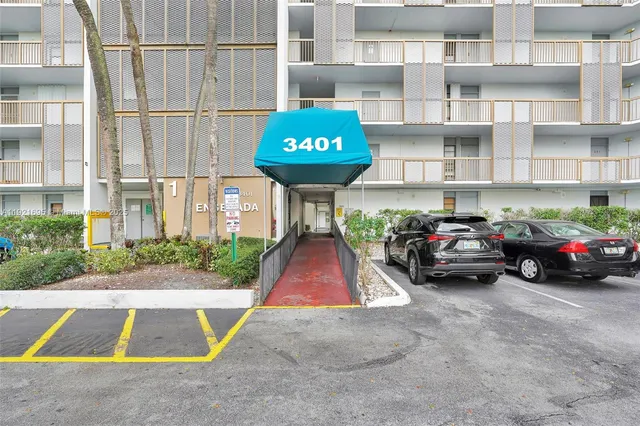 a view of residential building with outdoor space