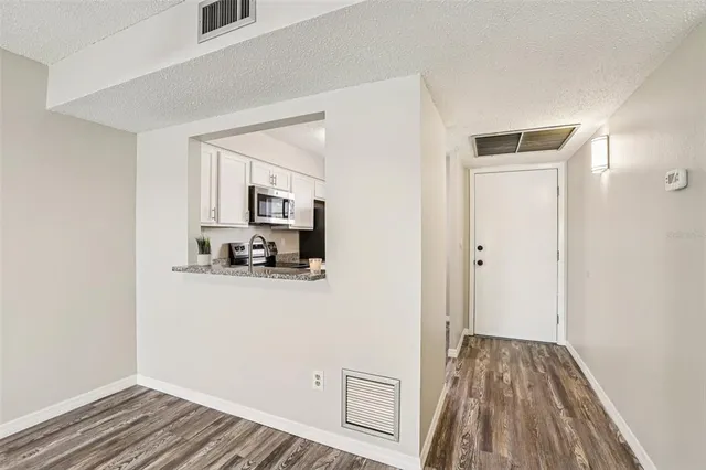 a view of a livingroom with wooden floor