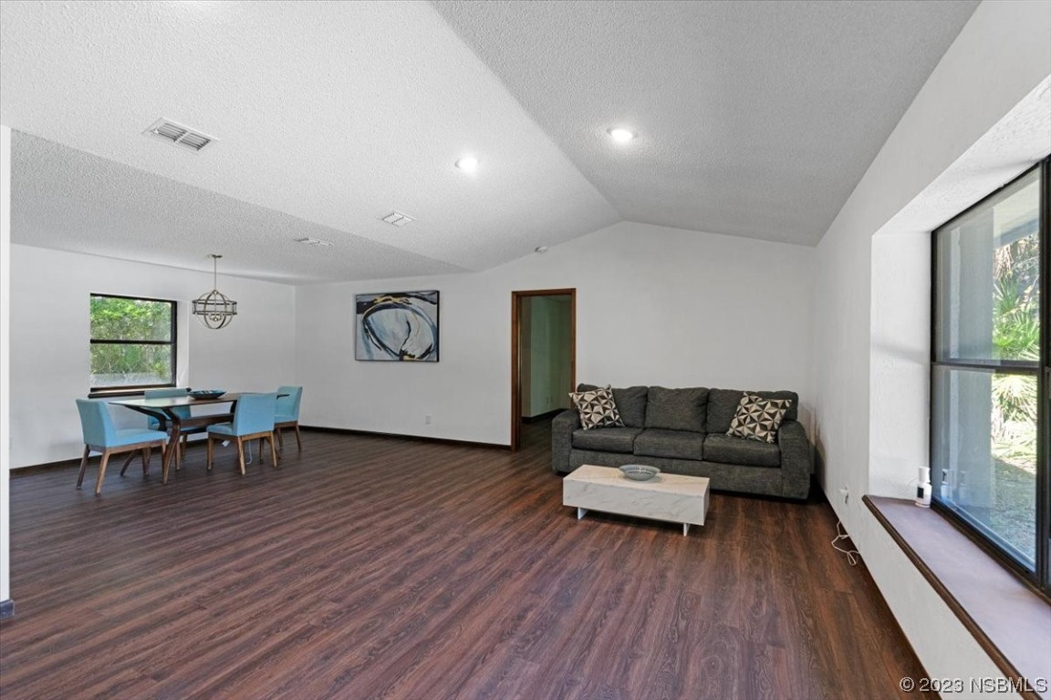 6202 Yellowstone Drive Port Orange, FL 32127 - Photo 12 of 34 a living room with furniture and a wooden floor