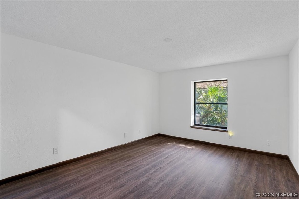 6202 Yellowstone Drive Port Orange, FL 32127 - Photo 22 of 34 a view of an empty room with wooden floor and a window