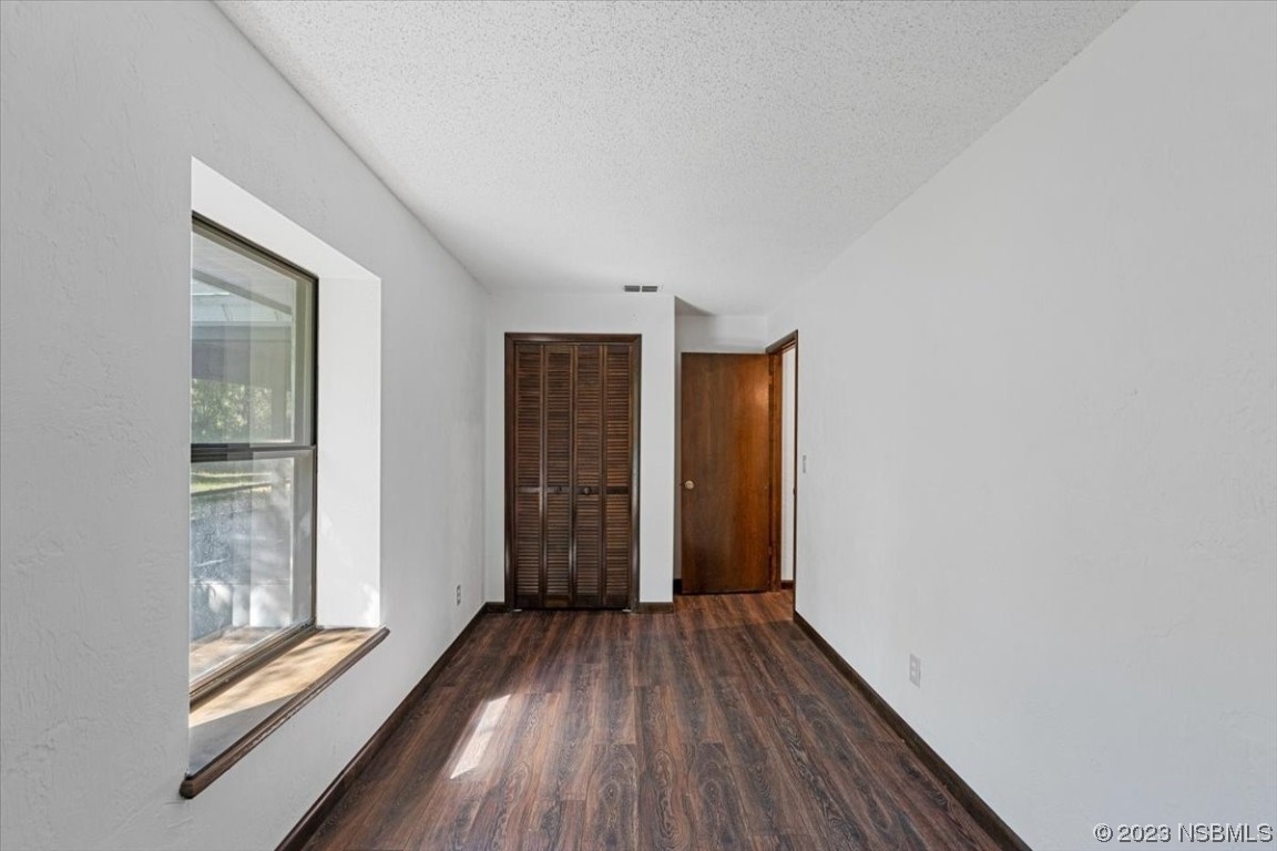 6202 Yellowstone Drive Port Orange, FL 32127 - Photo 25 of 34 a view of a room with wooden floor and front door