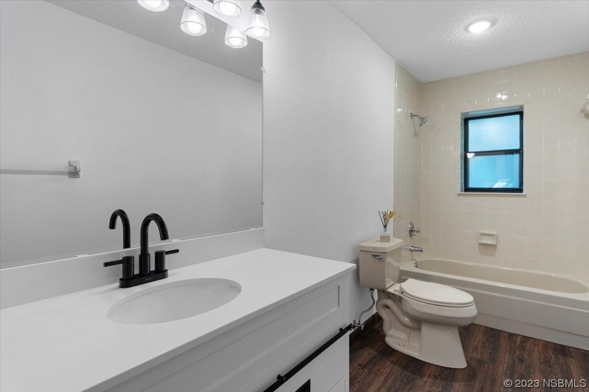 6202 Yellowstone Drive Port Orange, FL 32127 - Photo 26 of 34 a bathroom with a sink toilet and a mirror