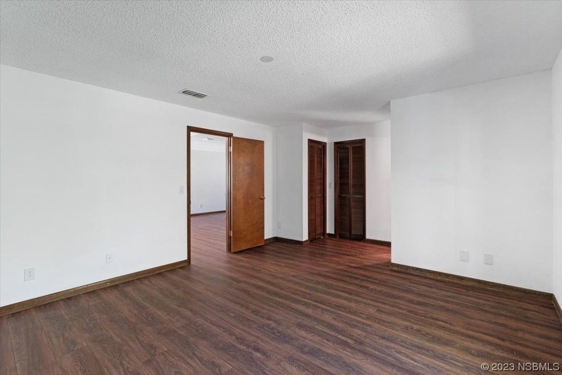 6202 Yellowstone Drive Port Orange, FL 32127 - Photo 29 of 34 a view of an empty room with wooden floor and closet