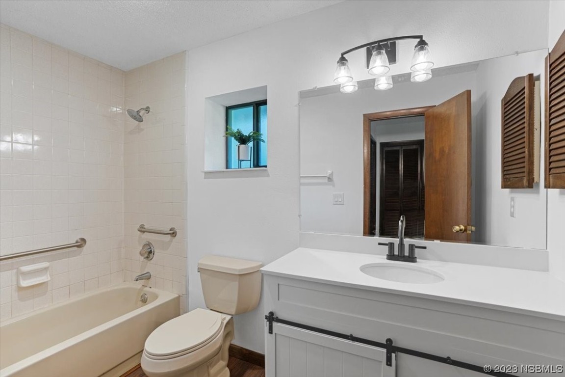 6202 Yellowstone Drive Port Orange, FL 32127 - Photo 30 of 34 a bathroom with a sink a toilet and shower