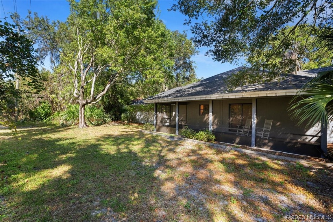 6202 Yellowstone Drive Port Orange, FL 32127 - Photo 10 of 34 a view of a house with a yard