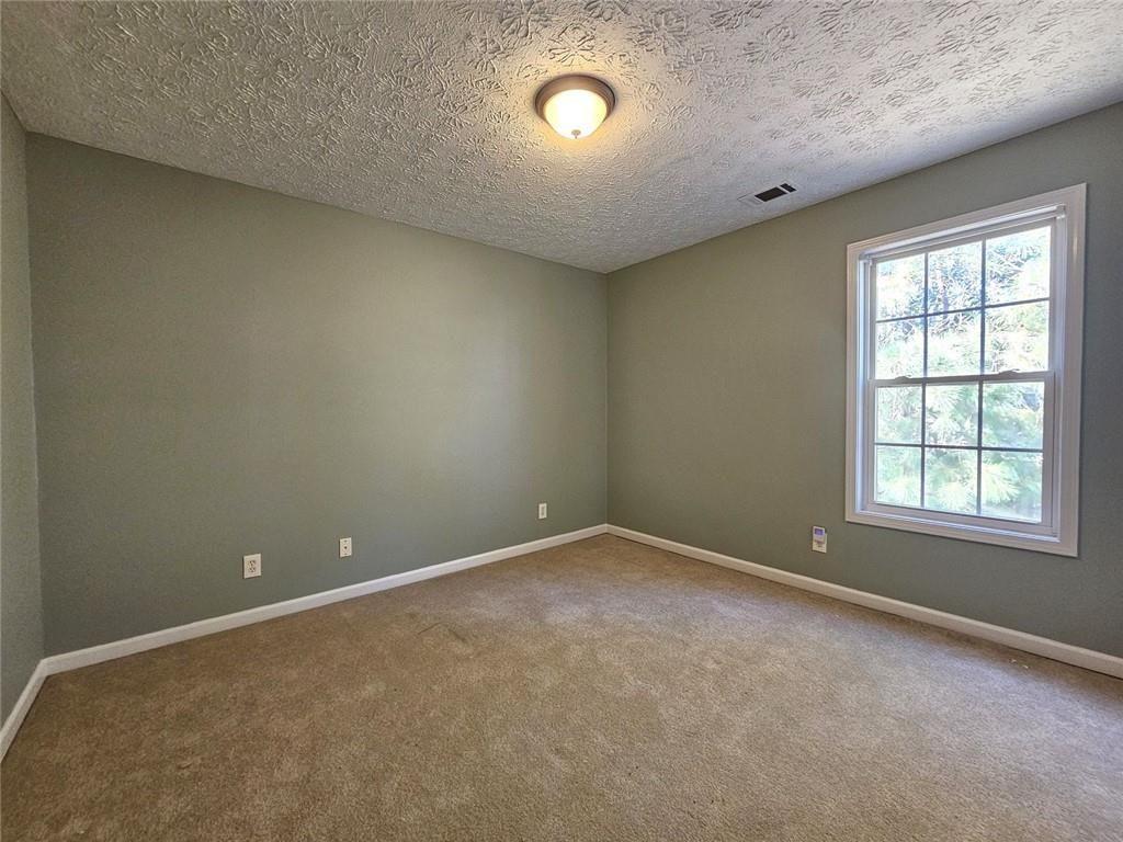 303 Apache Drive Canton, GA 30115 - Photo 13 of 19 an empty room with a window