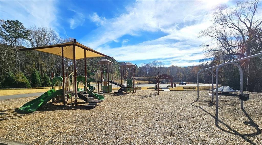 303 Apache Drive Canton, GA 30115 - Photo 17 of 19 a view of a backyard with a sitting area