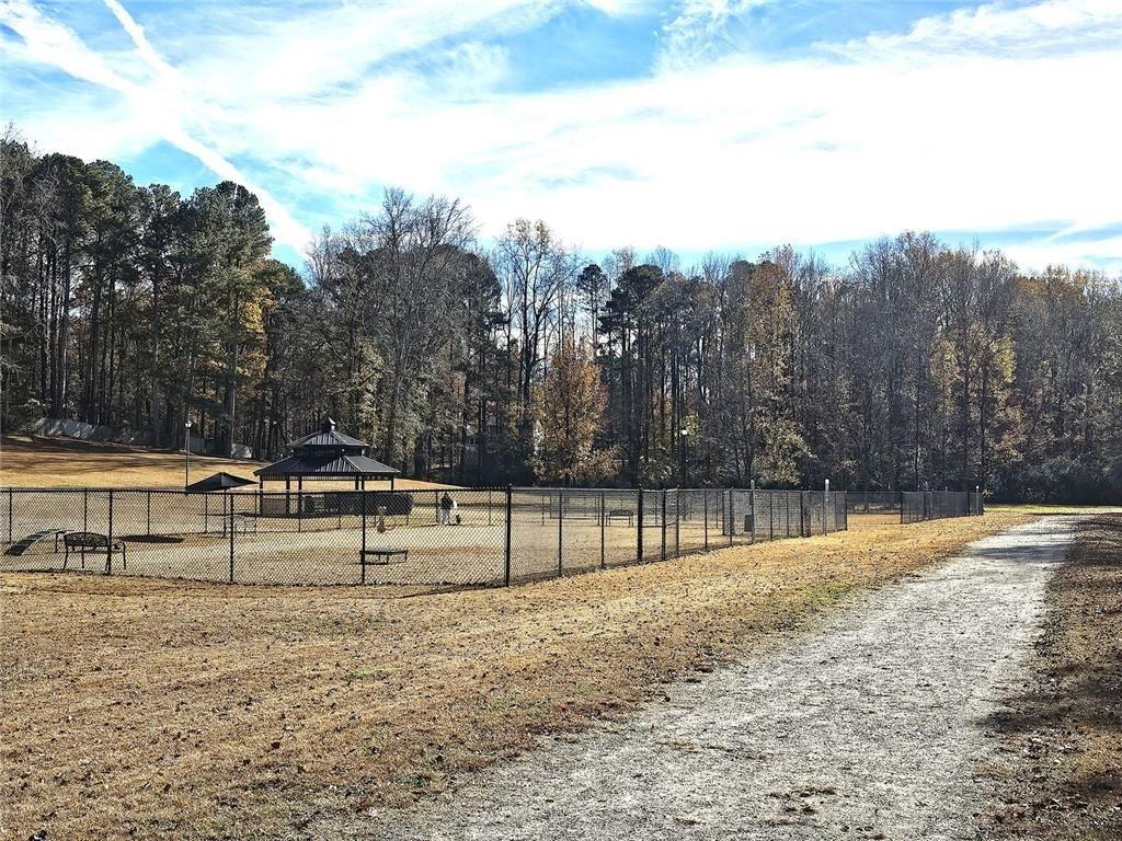 303 Apache Drive Canton, GA 30115 - Photo 19 of 19 a view of house with trees in the background