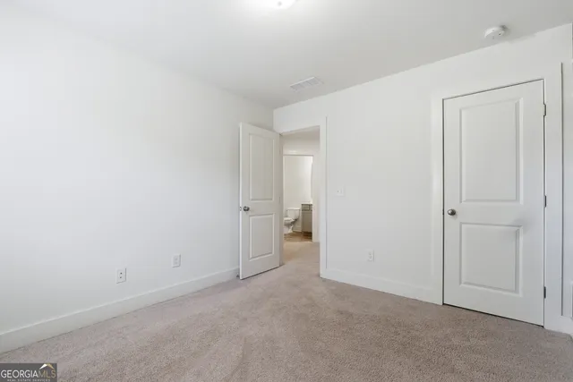 a view of an empty room and a room