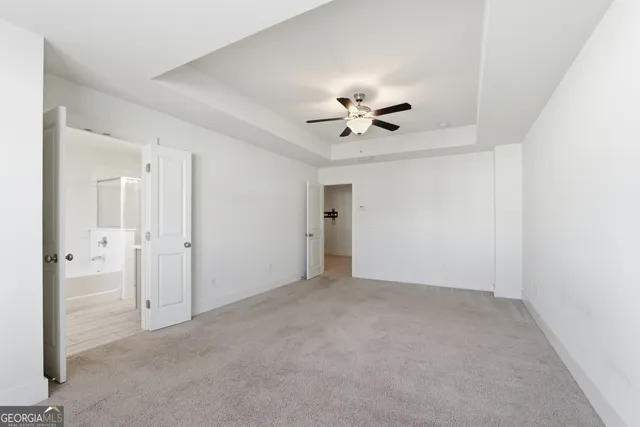 a view of an empty room with a bathroom