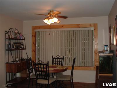 1608 Donalds Road Effort, PA 18330 - Photo 5 of 9 a view of a dining room with furniture and chandelier