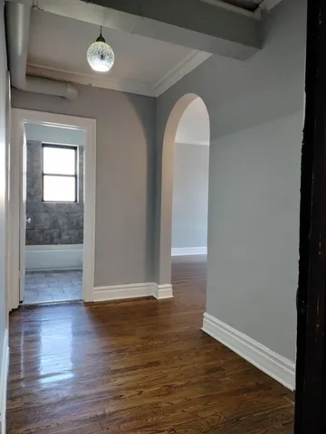 a view of entryway with wooden floor