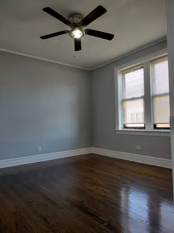 a view of wooden floor and windows in a room