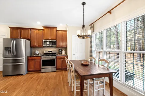 a view of a dining room with furniture and wooden floor