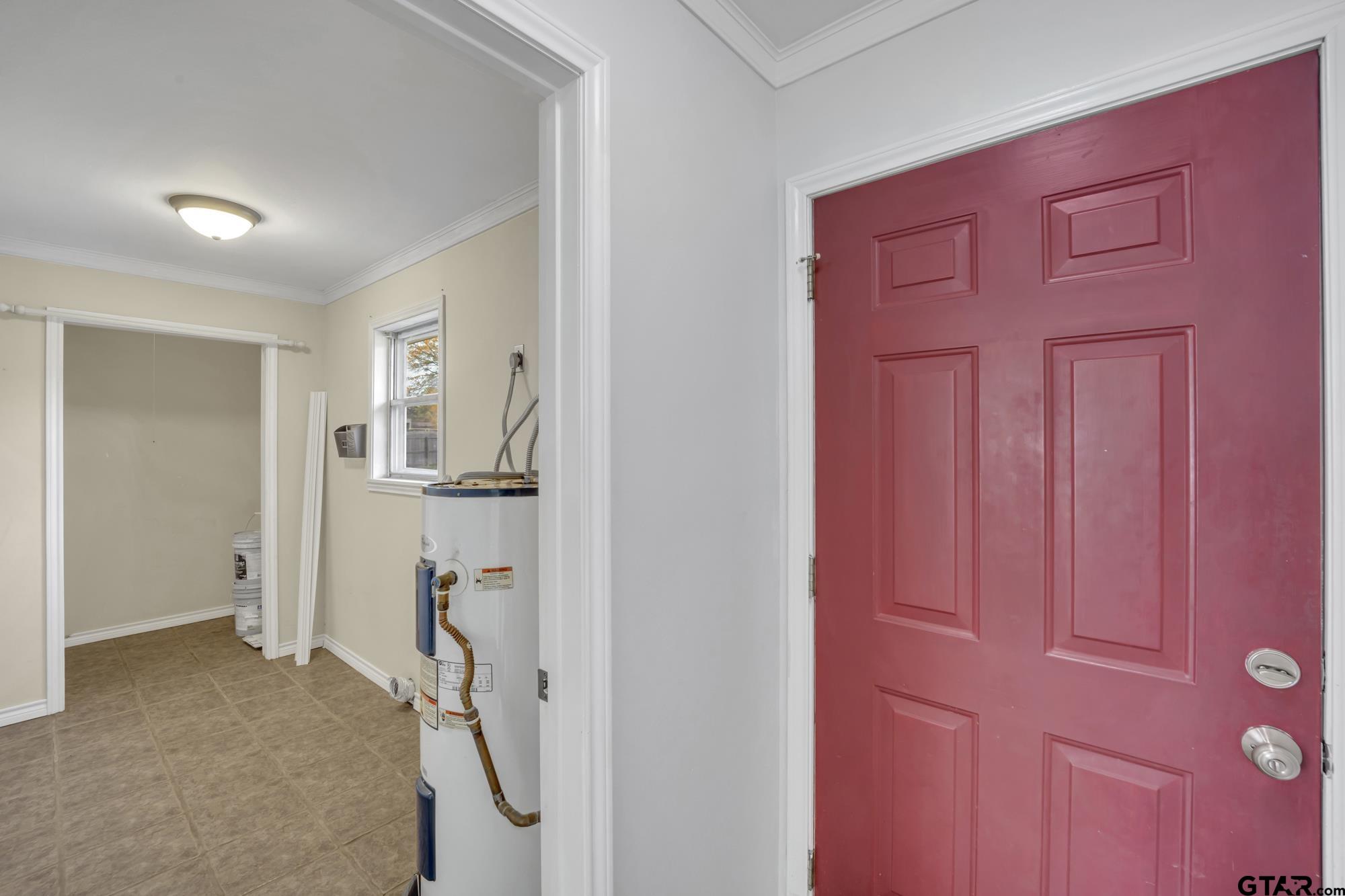 3743 Smelley Road Longview, TX 75605 - Photo 9 of 25 a view of a livingroom with a furniture and front door
