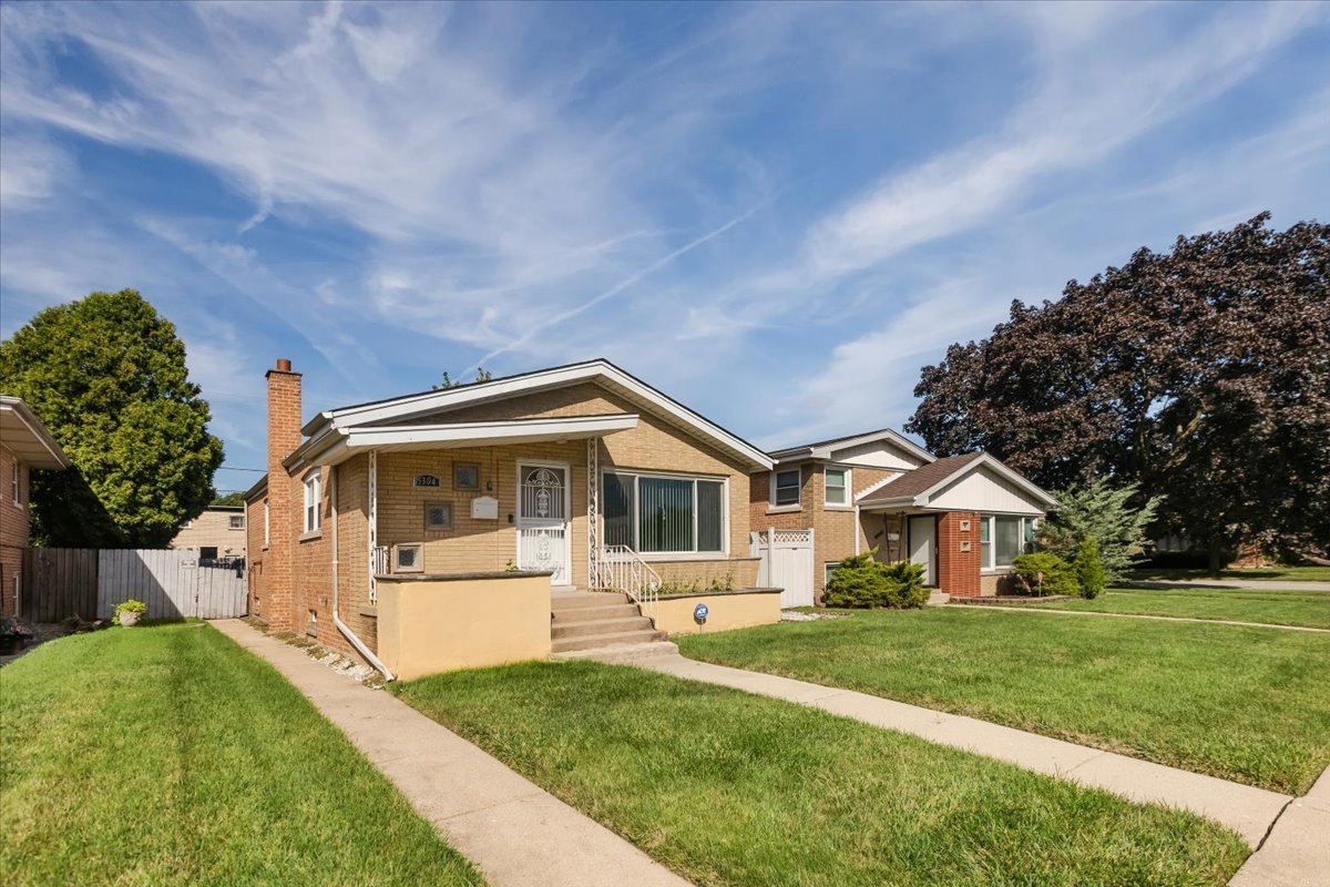 15304 Grant Street Dolton, IL 60419 - Photo 2 of 32 a front view of a house with a yard