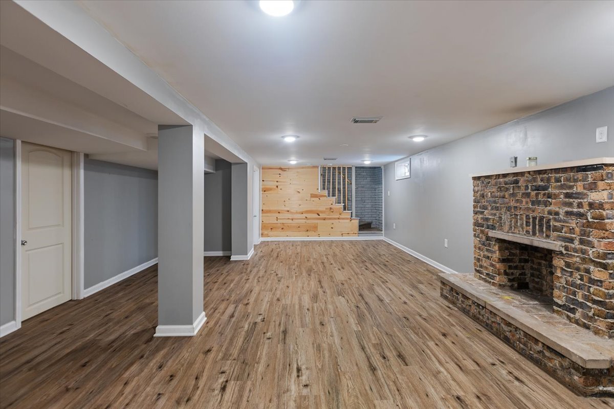 15304 Grant Street Dolton, IL 60419 - Photo 22 of 32 a view of empty room with wooden floor and fireplace
