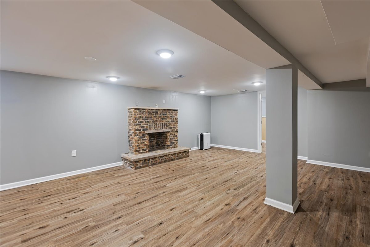 15304 Grant Street Dolton, IL 60419 - Photo 23 of 32 a view of an empty room with wooden floor and a fireplace