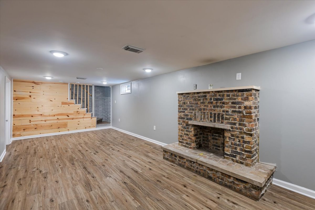 15304 Grant Street Dolton, IL 60419 - Photo 24 of 32 a view of an empty room with wooden floor fireplace and a window