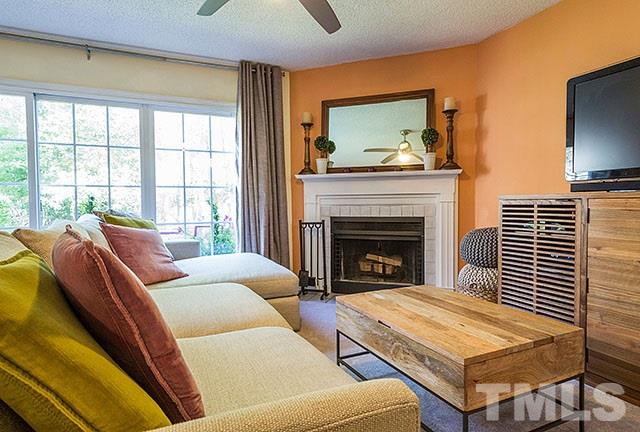7777 Falcon Rest Circle Raleigh, NC 27615 - Photo 6 of 24 a living room with furniture and a fireplace