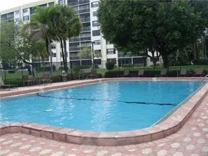 a view of a swimming pool with a patio