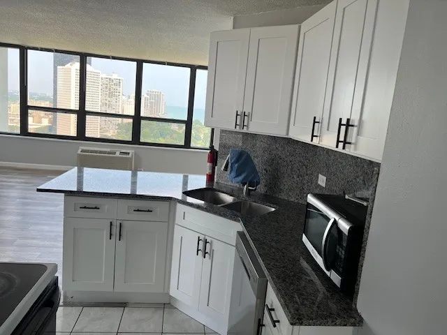 a kitchen with a sink and a stove