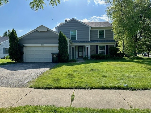 2301 Modaff Road Naperville, IL 60565 - Photo 1 of 24 a view of a house with a yard and potted plants