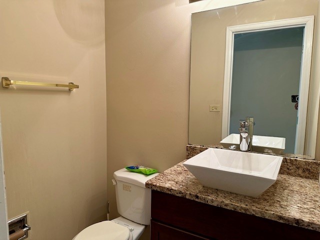 2301 Modaff Road Naperville, IL 60565 - Photo 13 of 24 a bathroom with a granite countertop sink a mirror and a toilet
