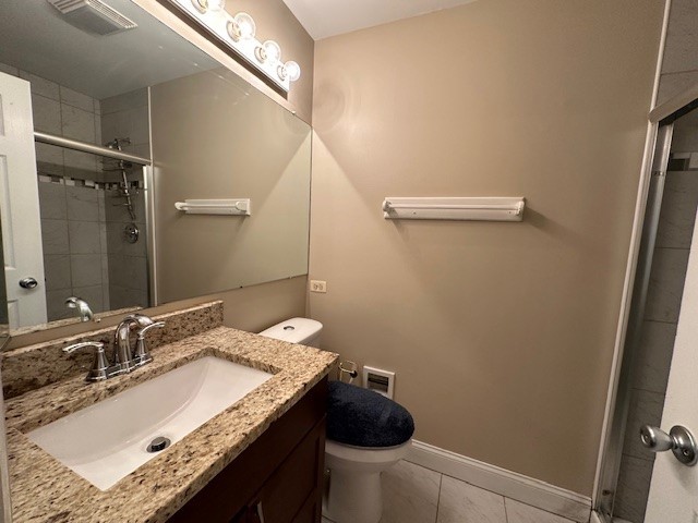 2301 Modaff Road Naperville, IL 60565 - Photo 18 of 24 a bathroom with a granite countertop sink a toilet and a mirror