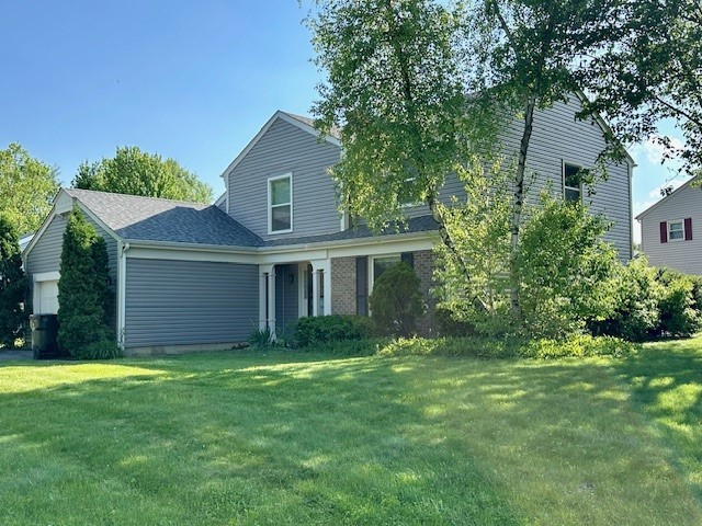 2301 Modaff Road Naperville, IL 60565 - Photo 2 of 24 a front view of a house with a garden and yard