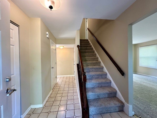 2301 Modaff Road Naperville, IL 60565 - Photo 3 of 24 a view of a hallway with wooden floor and staircase