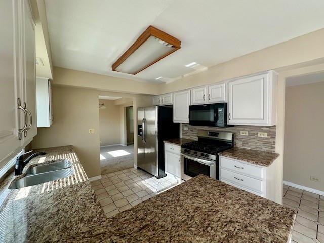 2301 Modaff Road Naperville, IL 60565 - Photo 8 of 24 a kitchen with stainless steel appliances kitchen island granite countertop a stove and a sink