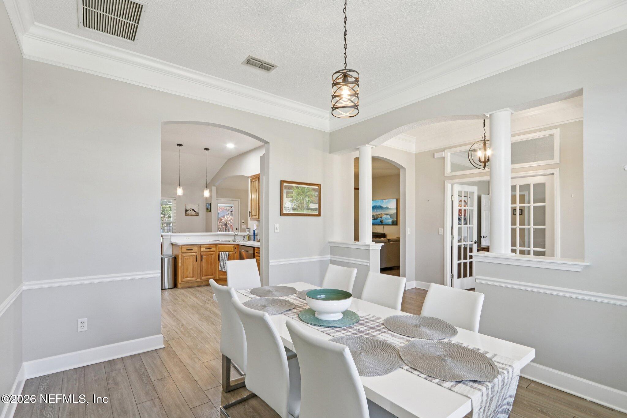 1405 Sinclair Lane Jacksonville, FL 32221 - Photo 11 of 37 a view of a dining room with furniture window and wooden floor