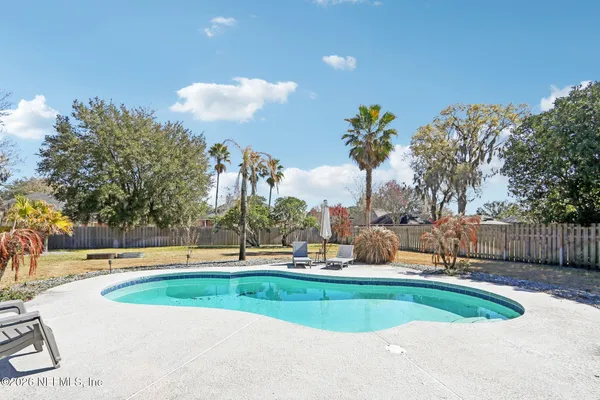 a view of a fountain in front of a house