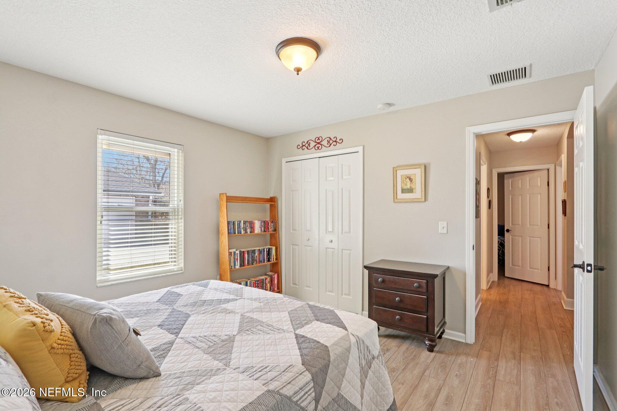 1405 Sinclair Lane Jacksonville, FL 32221 - Photo 21 of 37 a bedroom with a bed and a television