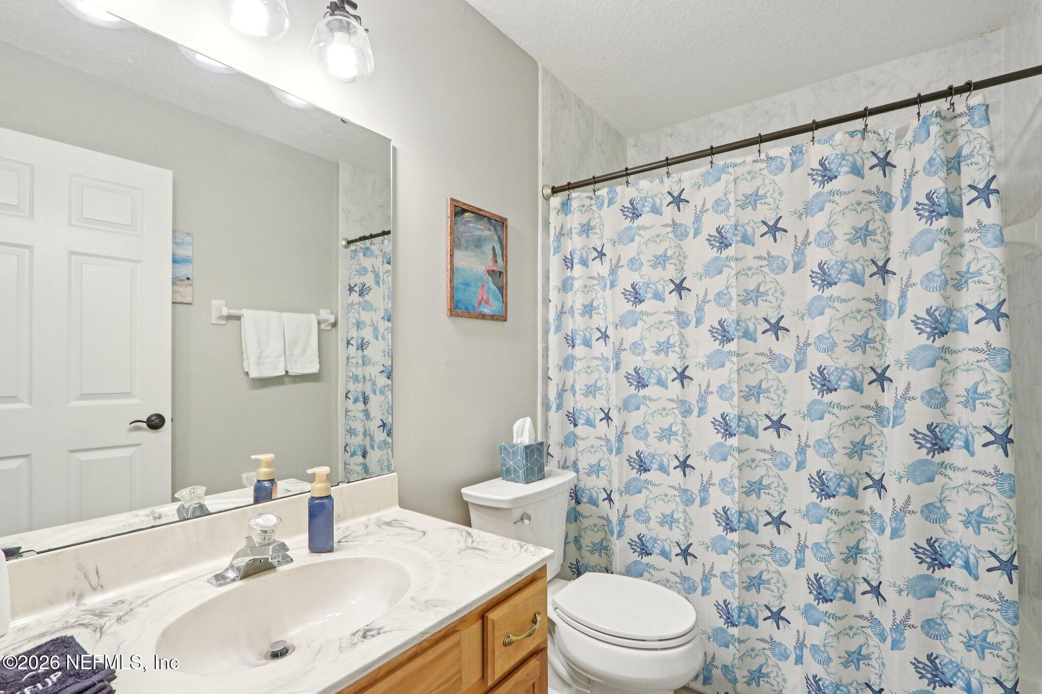 1405 Sinclair Lane Jacksonville, FL 32221 - Photo 22 of 37 a bathroom with a sink and a toilet