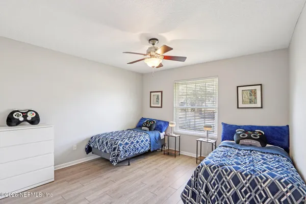 a bedroom with bed and a window